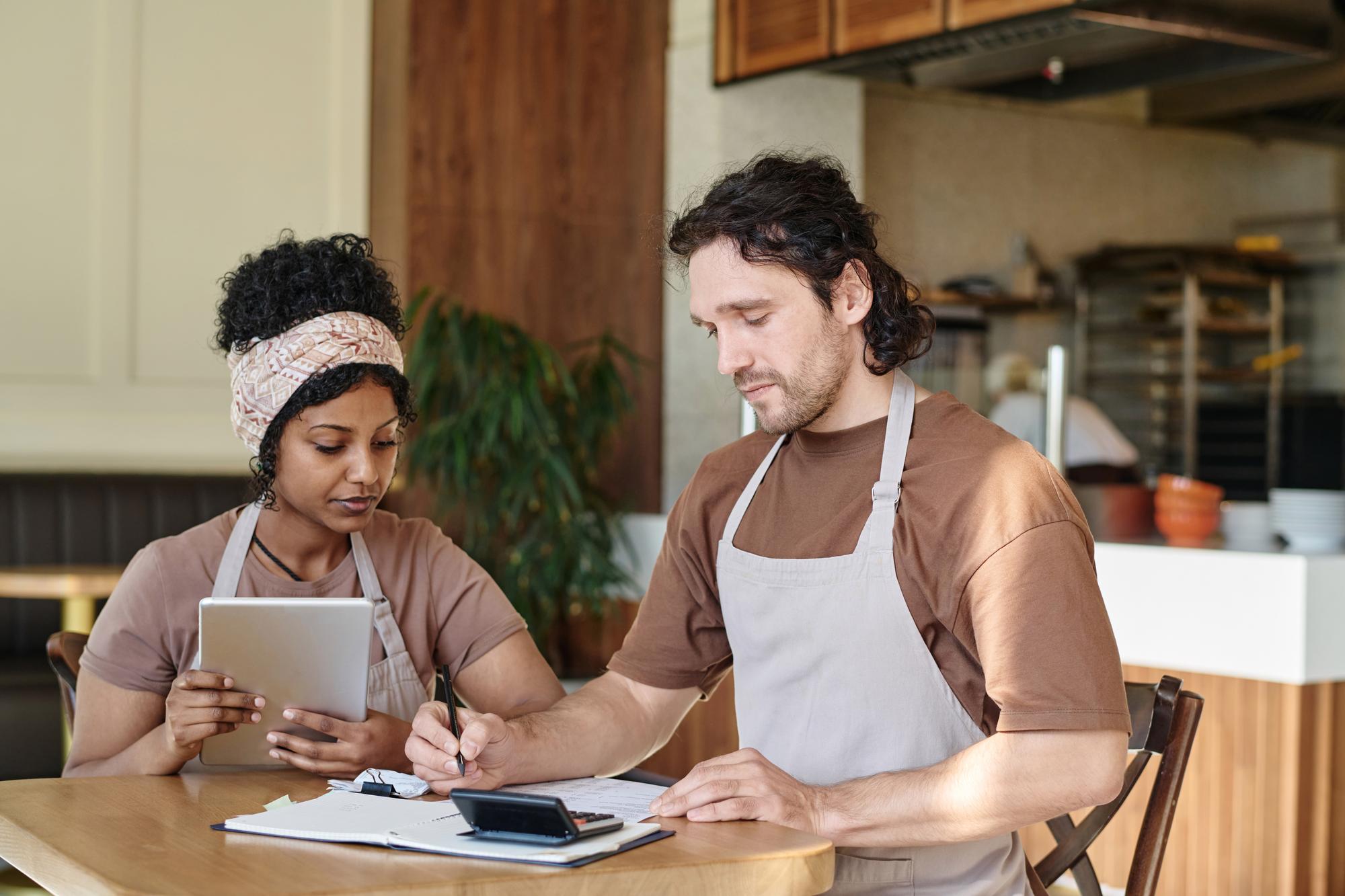 Chef and client reviewing menu notes